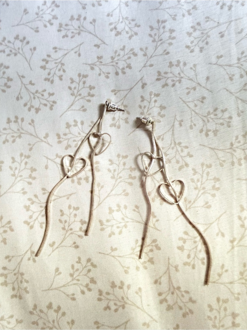 Delicate Double Heart Dangle Earrings in Silver color